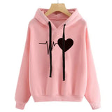 a pink hoodie with a black heart on the front