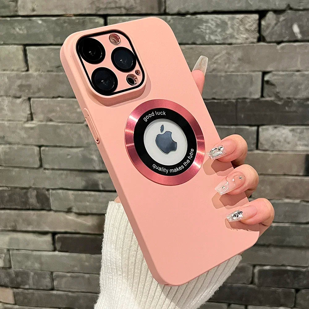 Pink iPhone case with a circular metallic accent ring.