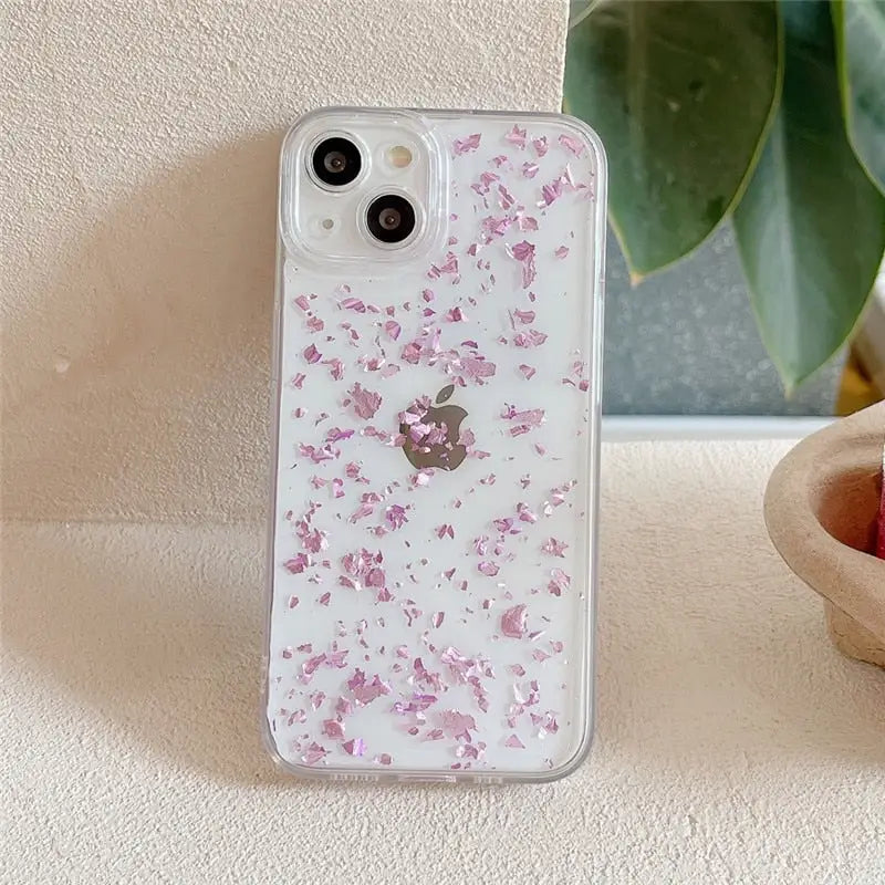 a pink iphone case with a flower design