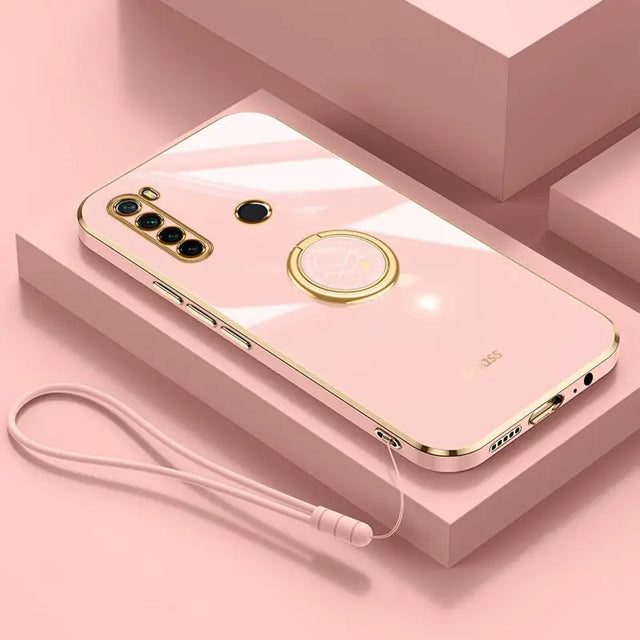 a pink iphone case with a gold ring