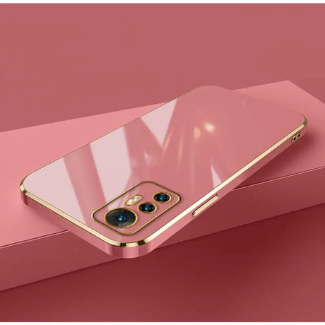 A pink iphone case with a gold frame