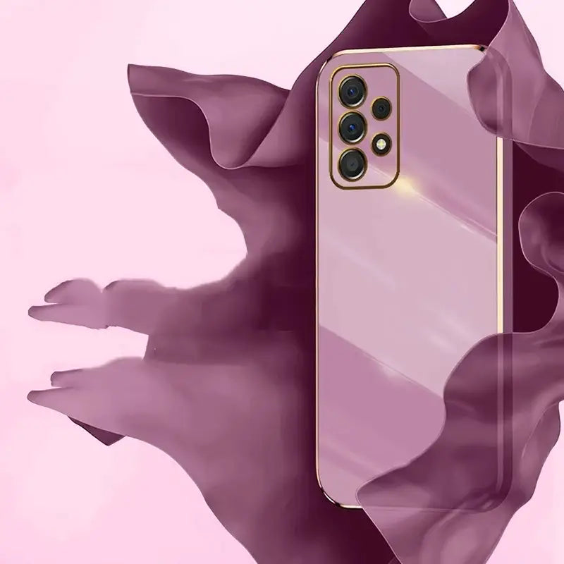 a pink iphone case with a gold frame