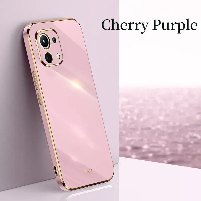 a pink iphone case with a gold frame