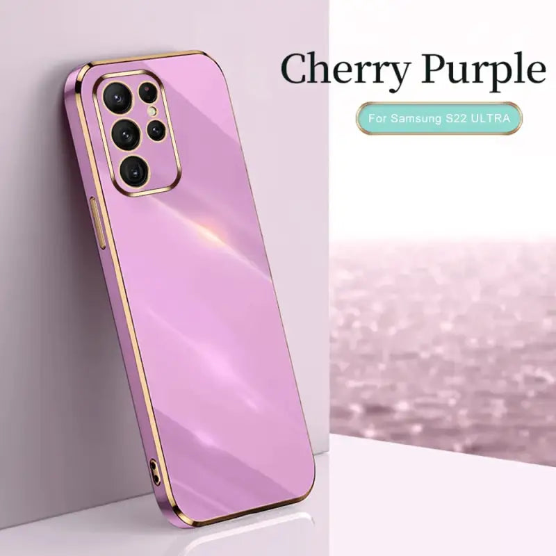 a pink iphone case with a gold frame