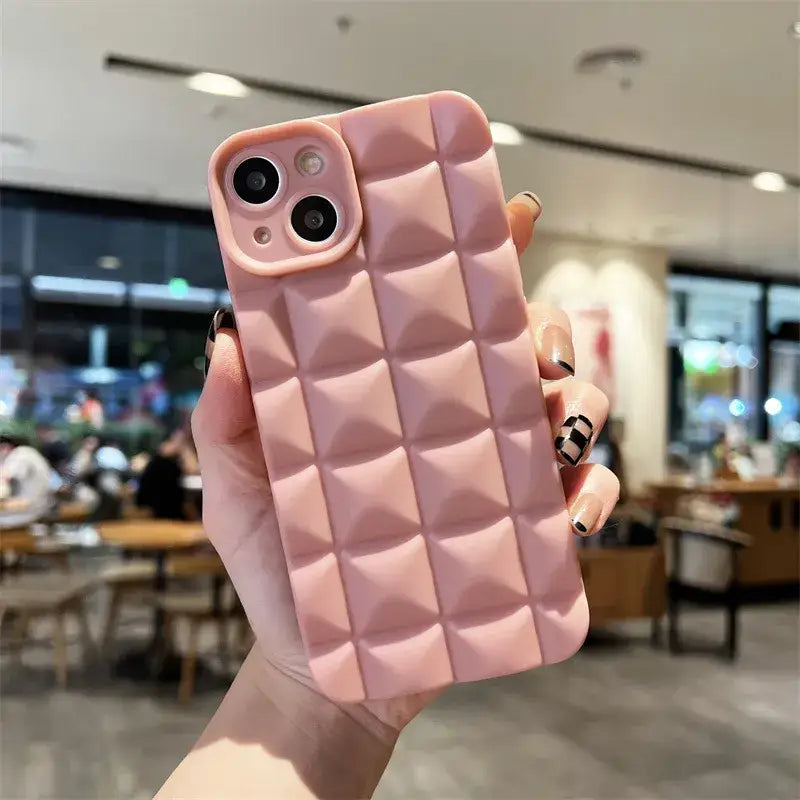 a pink iphone case with a pink quilt pattern