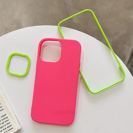 a pink phone case sitting on top of a white table