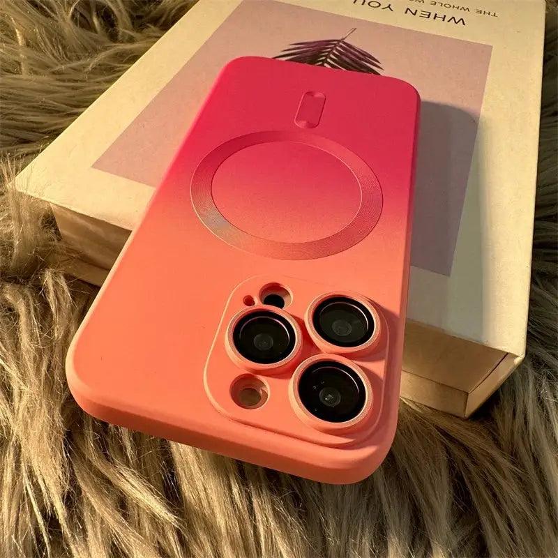 a pink iphone case with two lenses on it