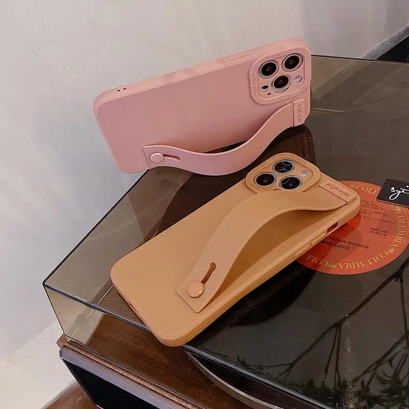 a pink phone case sitting on top of a table