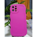 a pink iphone case sitting on top of a table