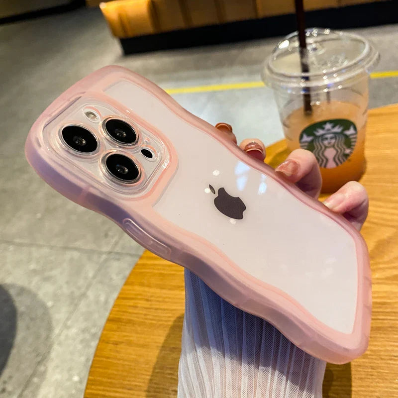 A pink iphone case with a starbucks cup in the background