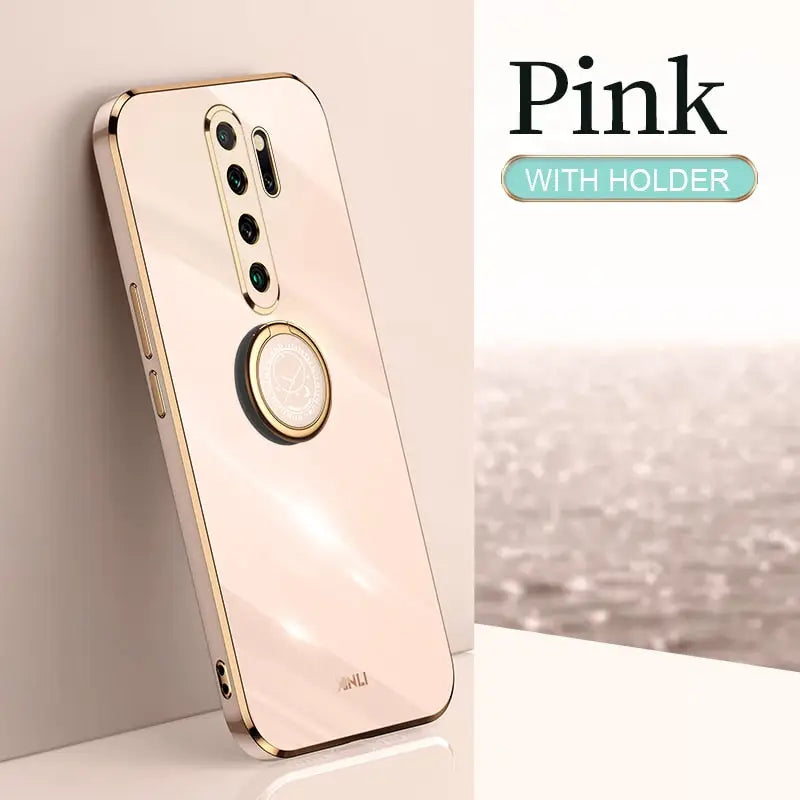 a gold phone with a white background and a pink background