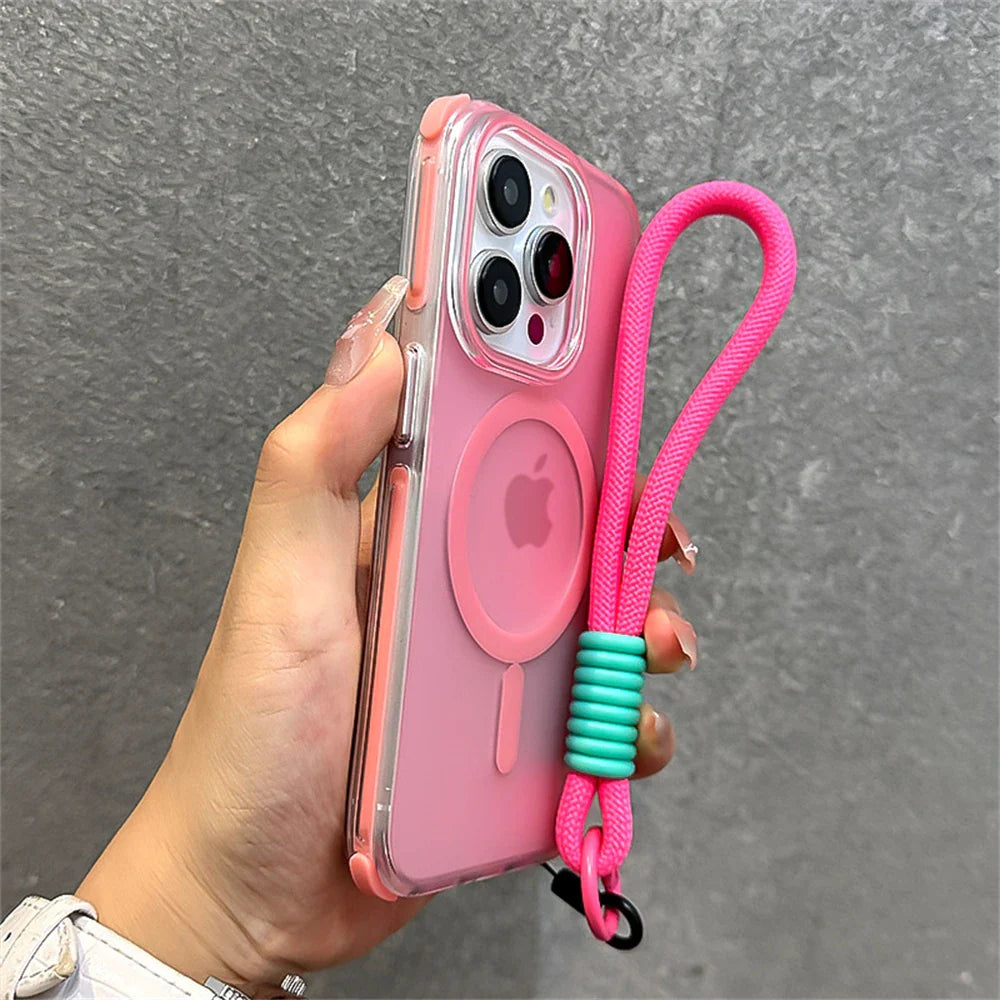 Pink iPhone in clear case with pink lanyard.