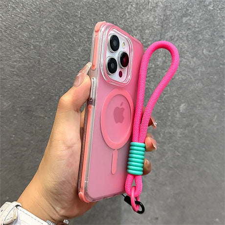 Pink iPhone in clear case with pink lanyard.