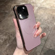Pink iPhone with a protective case featuring a camera cutout and a lightning bolt symbol.