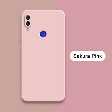 A pink iphone with the text sakura pink on it