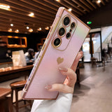 Pink iridescent phone case with a heart design and sparkling accents.