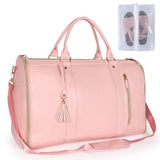 a pink leather duff with a clear bag