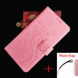 a pink leather wallet case with a floral design