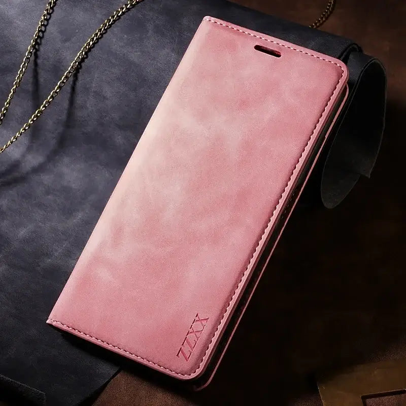 a pink leather wallet case with chain