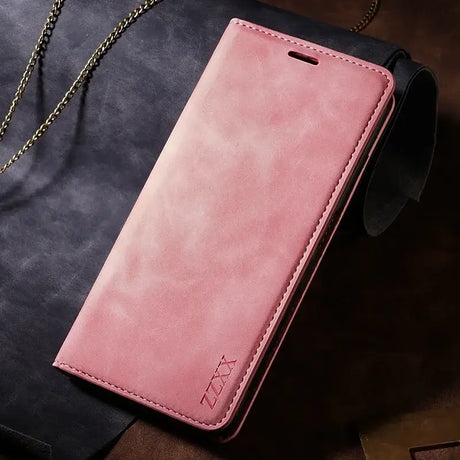 A pink leather wallet case with chain