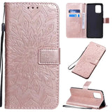 A pink leather wallet case with a flower design