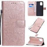 a pink leather wallet case with a flower design