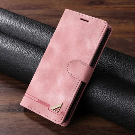 Pink leather wallet-style phone case with a metallic accent.