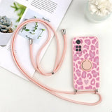 a pink leopard print phone case with a pink strap