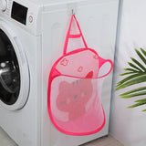 a pink mesh laundry bag hanging on the side of a washing machine