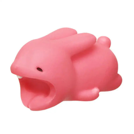 a pink pig toy with its mouth open