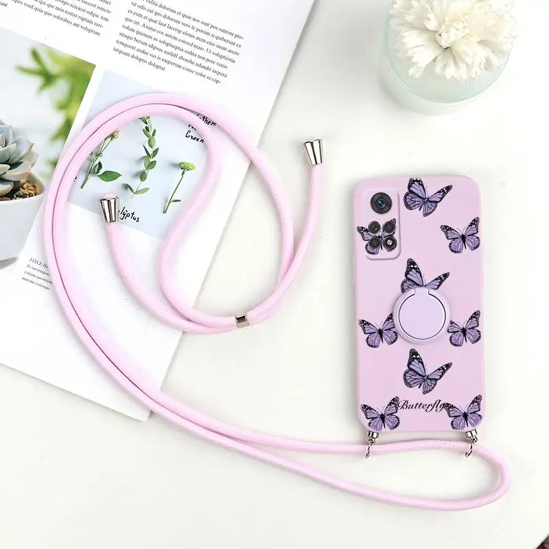a pink phone case with butterflies on it