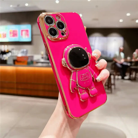 A pink phone case with a camera and sunglasses