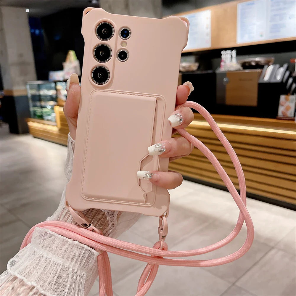 Pink phone case with a card slot and a matching lanyard.