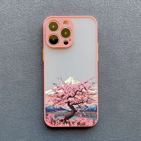 a pink phone case with a cherry blossom tree on it