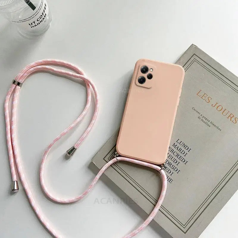 a pink phone case with a pink cord