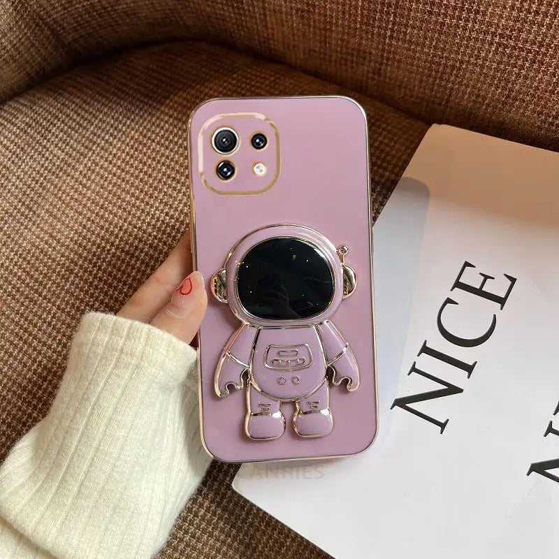 a pink phone case with a dog on it