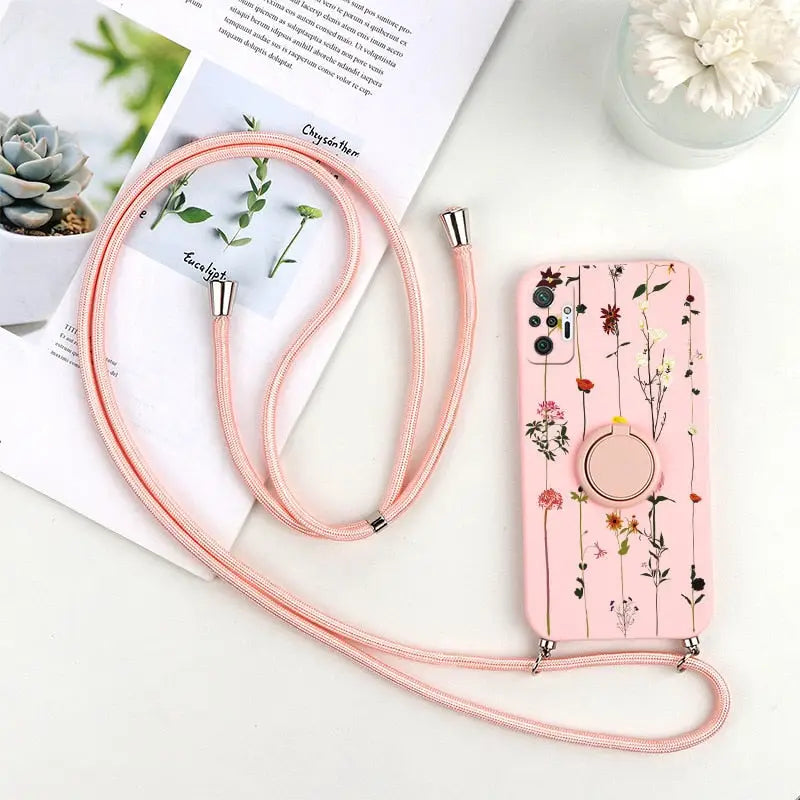 a pink phone case with a floral design