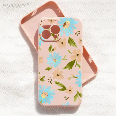 A pink phone case with a floral pattern