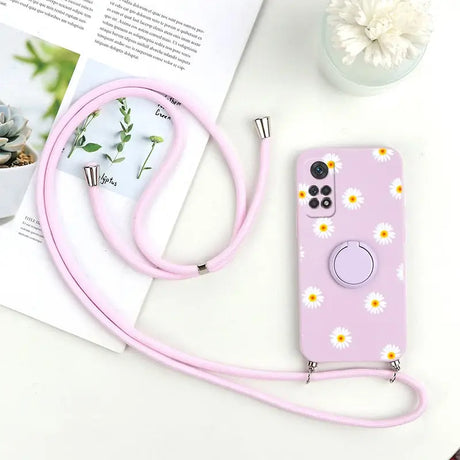 a pink phone case with a flower design