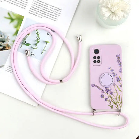 a pink phone case with a flower design on it