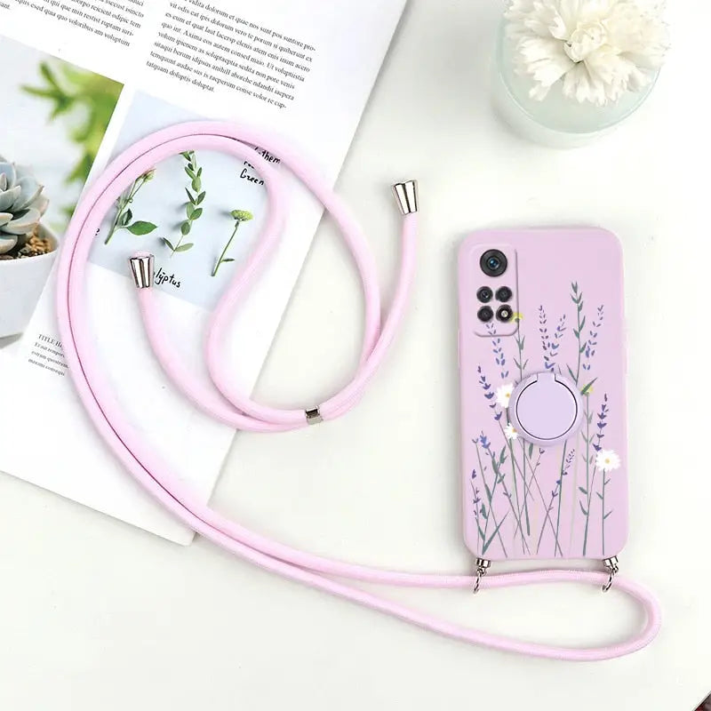a pink phone case with a flower design