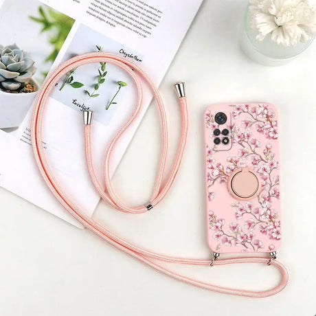 a pink phone case with a flower design on it