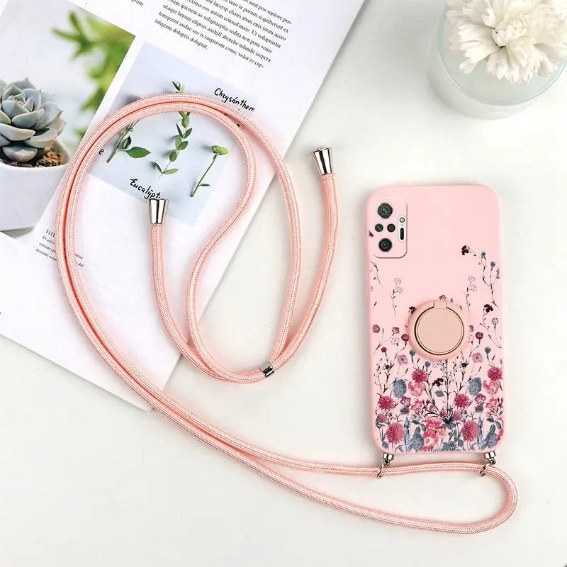 a pink phone case with a flower design