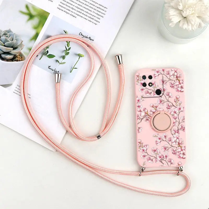 a pink phone case with a flower design on it