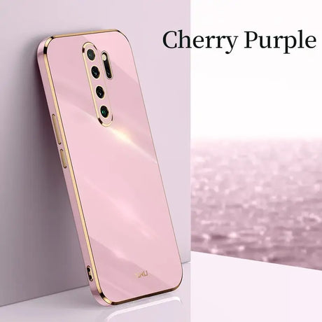 a pink phone case with a gold frame