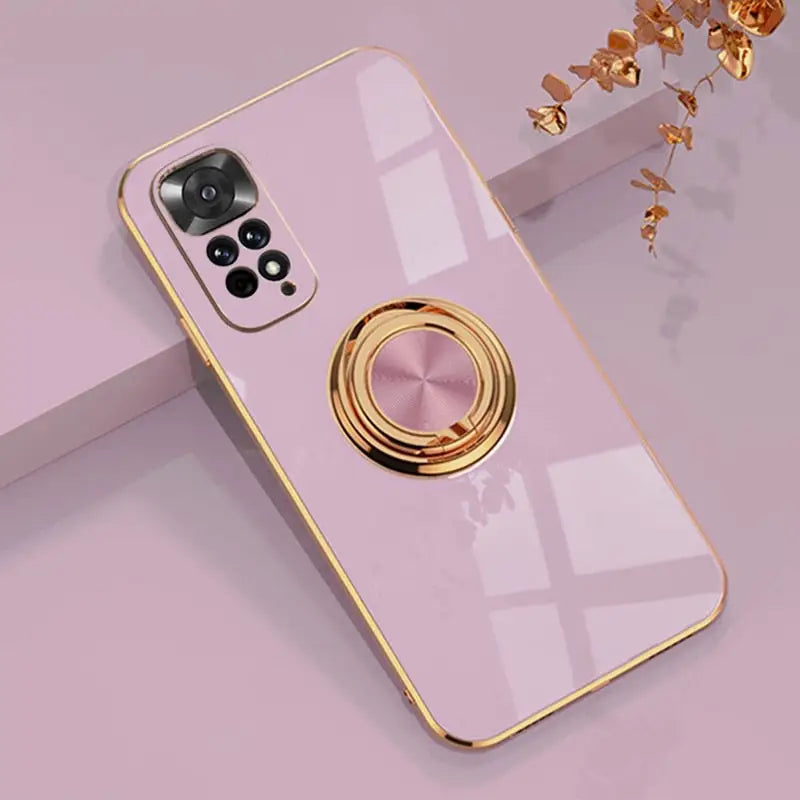 a pink phone case with a gold ring