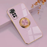 a pink phone case with a gold ring