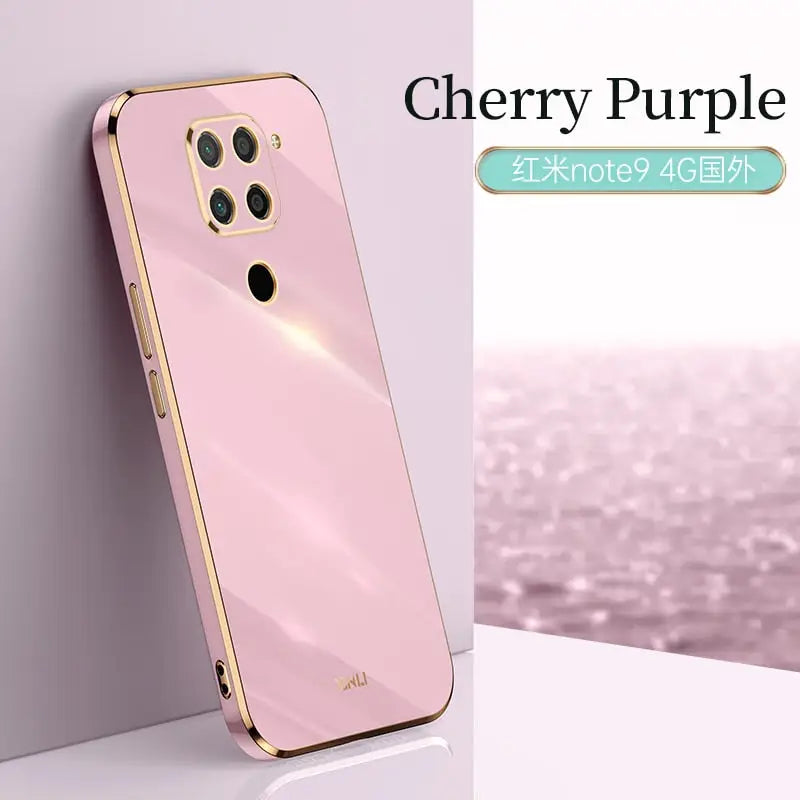 a pink phone case with a gold frame