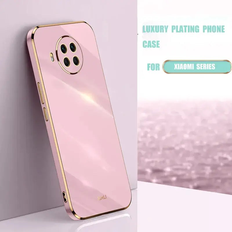 A pink phone case with a gold frame