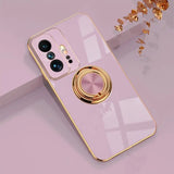 a pink phone case with a gold ring